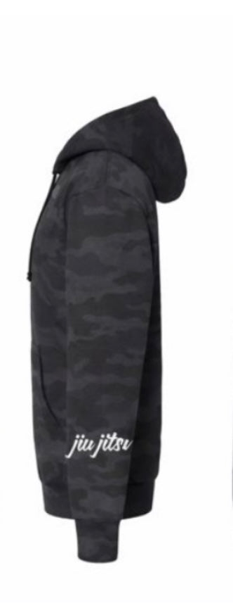 Side view of SBR Black Camo Fists Hoodie showing cursive jiu jitsu sleeve embroidery in white