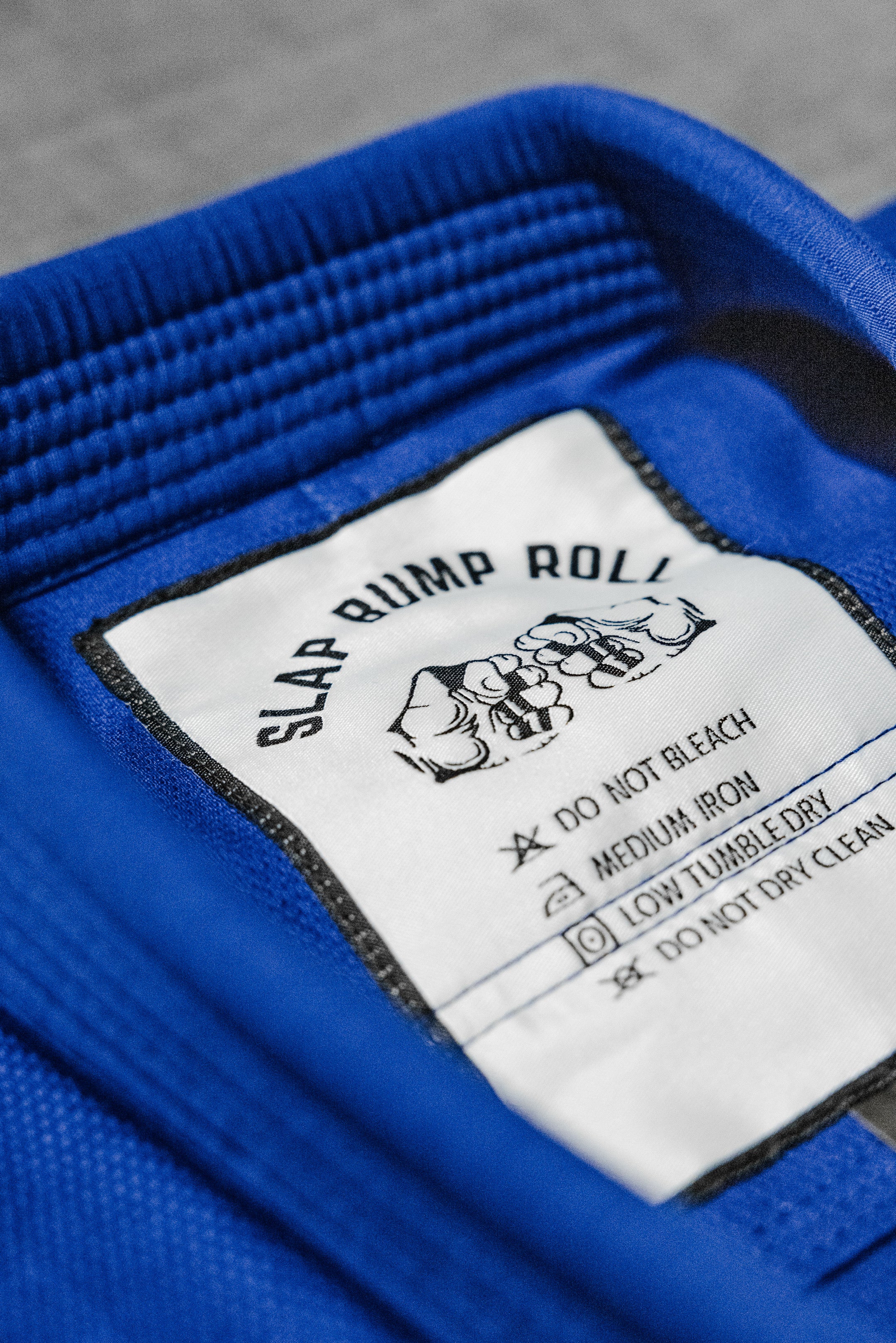 SBR Comp Lite Gi collar detail with Slap Bump Roll care label and reinforced collar construction