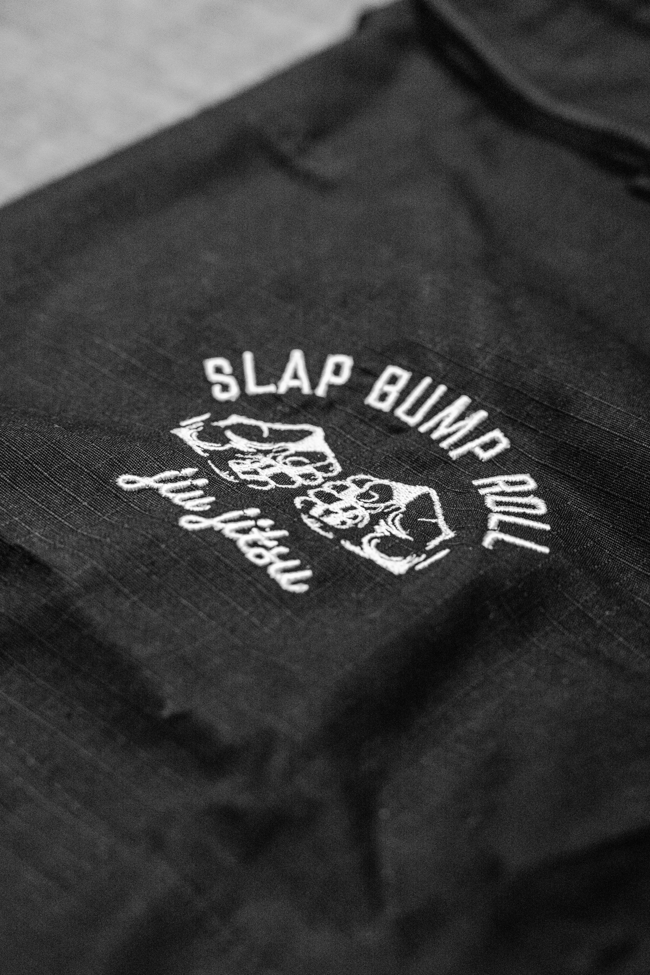 Slap Bump Roll fist bump jiu jitsu logo printed on SBR Comp Lite Gi pants leg