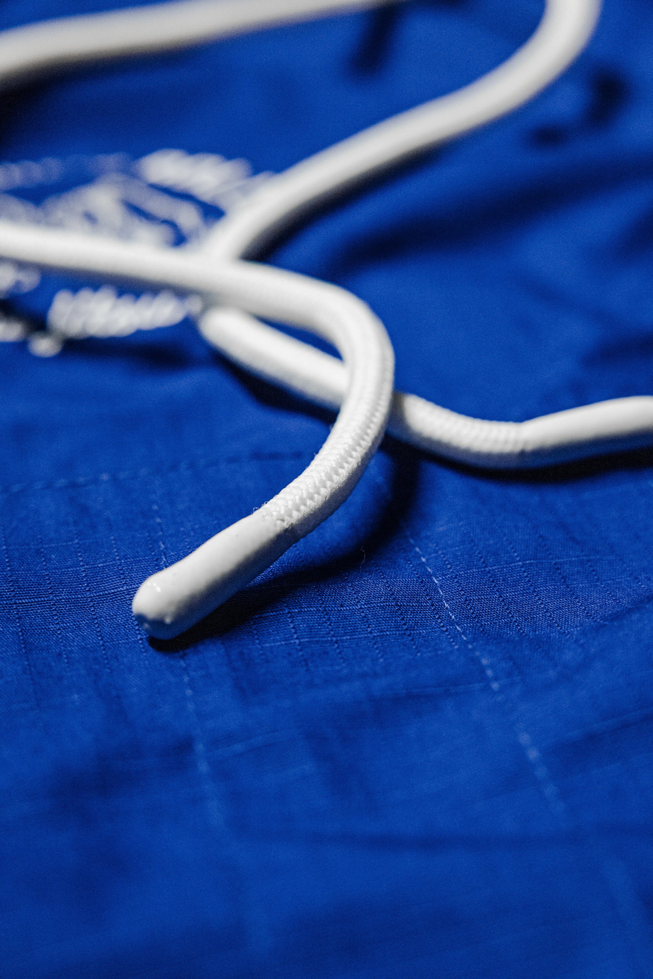 Zero-fray flat rope drawstring detail on blue SBR Comp Lite Gi pants