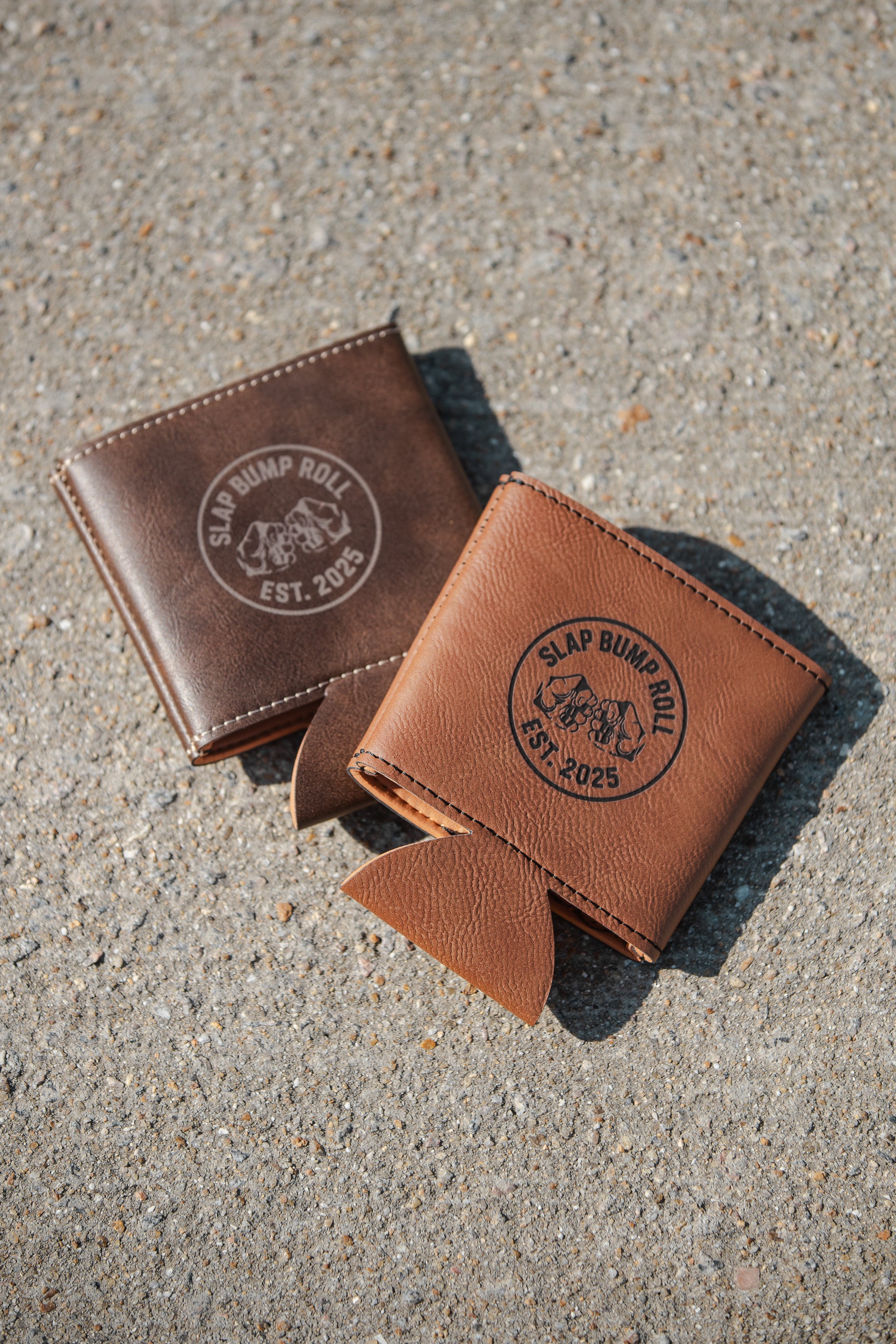 SBR Leatherette Koozies with Slap Bump Roll EST. 2025 circle logo shown in tan and dark brown leatherette